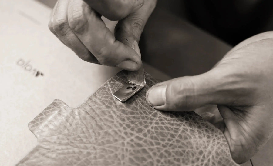 A 316 stainless steel corner shield being set by hand